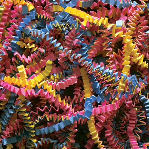 Add vibrant color and professional cushioning to your shipments with 10 lbs of Fiesta Blend crinkle paper per case. This multi-colored void fill combines blue, yellow, and pink paper strips in a unique zig-zag pattern that protects products while enhancing presentation. Perfect for gift baskets, retail packaging, and customer unboxing experiences.