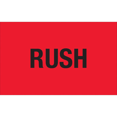 Bright fluorescent red rush labels in 1.25" x 2" dimensions printed on durable semi-gloss coated paper. Recognized across multiple countries for urgent shipping and handling compliance. Sold as 500-label rolls with compatible table-top and wall-mount dispensers available.
