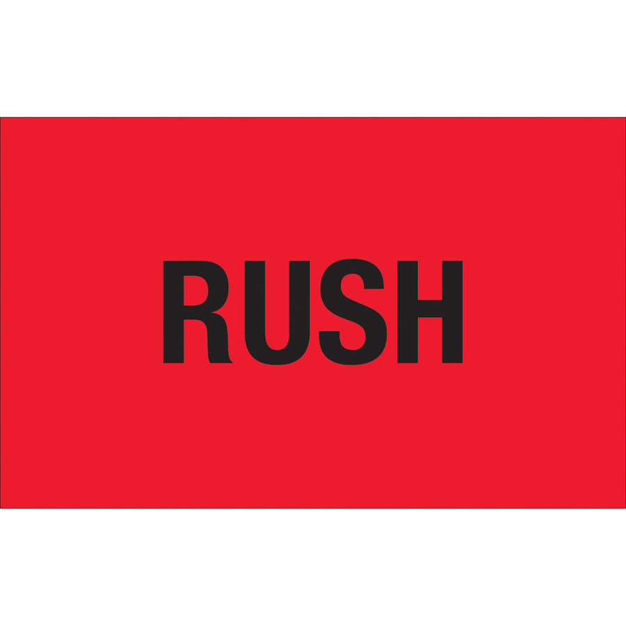 Bright fluorescent red rush labels in 1.25" x 2" dimensions printed on durable semi-gloss coated paper. Recognized across multiple countries for urgent shipping and handling compliance. Sold as 500-label rolls with compatible table-top and wall-mount dispensers available.
