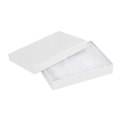Fully assembled white jewelry boxes built from rigid fibreboard with non-tarnishing jeweler's cotton fill–ready to ship in a case of 100. These 5.25" x 3.75" x 0.875" two-piece chipboard cartons protect small items while maintaining a premium retail presentation. Bulk pricing saves you money on every order.