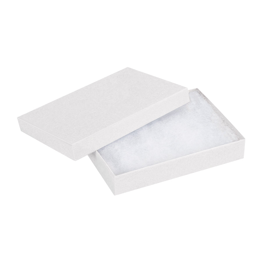 Fully assembled white jewelry boxes built from rigid fibreboard with non-tarnishing jeweler's cotton fill–ready to ship in a case of 100. These 5.25" x 3.75" x 0.875" two-piece chipboard cartons protect small items while maintaining a premium retail presentation. Bulk pricing saves you money on every order.
