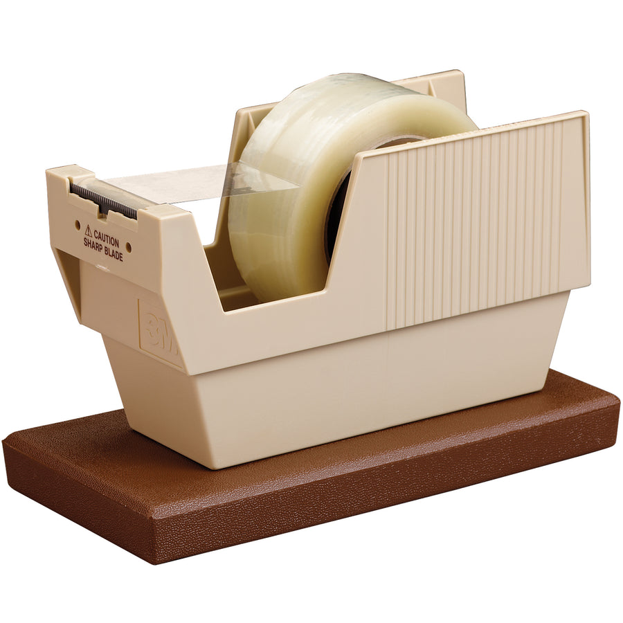 The 3M P52W table top dispenser streamlines adhesive tape application for high-speed packing operations. Features weighted stability, 2" wide blade, and one-handed dispensing of standard 3" core tape rolls. Built from high-impact plastic to withstand industrial demands and large-volume case sealing.